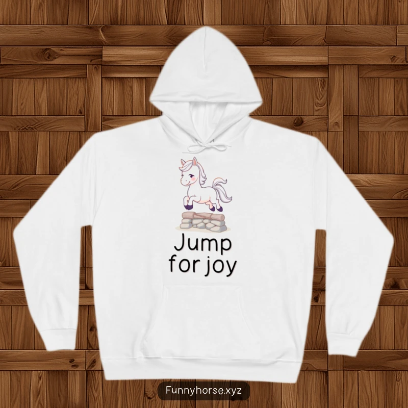 Funny playful white horse with a sparkling tail leaping over a small obstacle, a warm and humorous hoodie for adventurers.